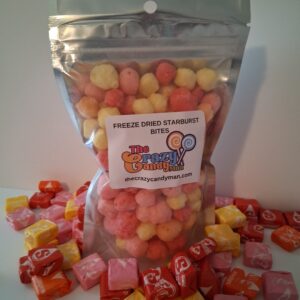 Bag of colorful fruit-flavored hard candies with scattered pieces.