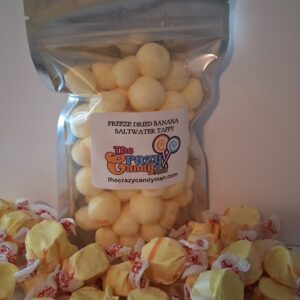 Bag of cheese balls and scattered rose petals on a surface.